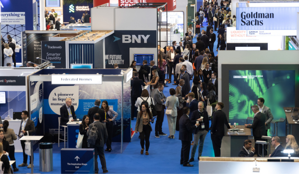 The bustling exhibition hall featuring global partners like BNY and Goldman Sachs at EuroFinance 2026.