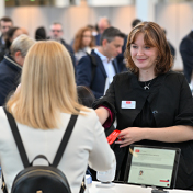 Thumbnail showing corporate treasurers registering for EuroFinance International Treasury Management